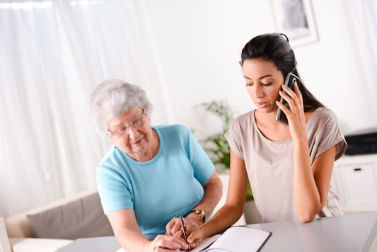 Private Caregiver helping senior woman